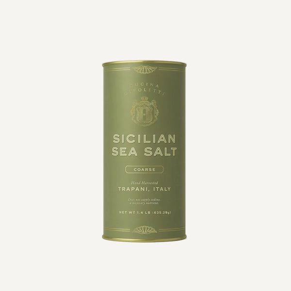 Green canister of Sicilian sea salt on a white background